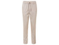 Pantalon beige avec cordon de serrage.