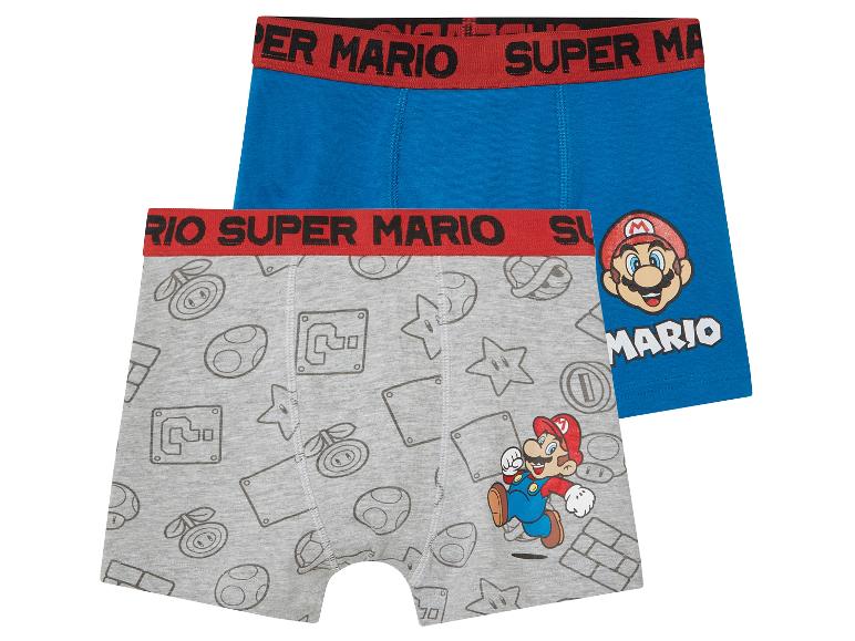 Deux boxers Super Mario pour enfants : un bleu uni et un gris avec des motifs Super Mario.