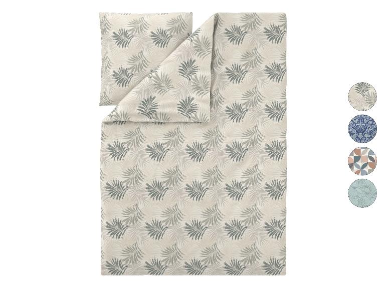 Parure de lit avec housse de couette et taie d'oreiller à motif feuilles de palmier beige et vert.