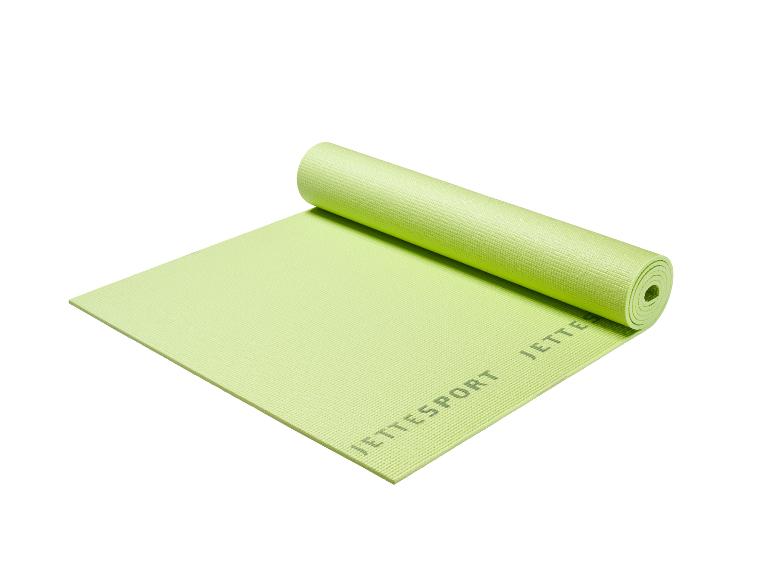 Tapis de yoga vert JETTESPORT, partiellement roulé, avec une surface texturée.
