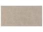 Tapis de bain beige avec un motif ondulé.
