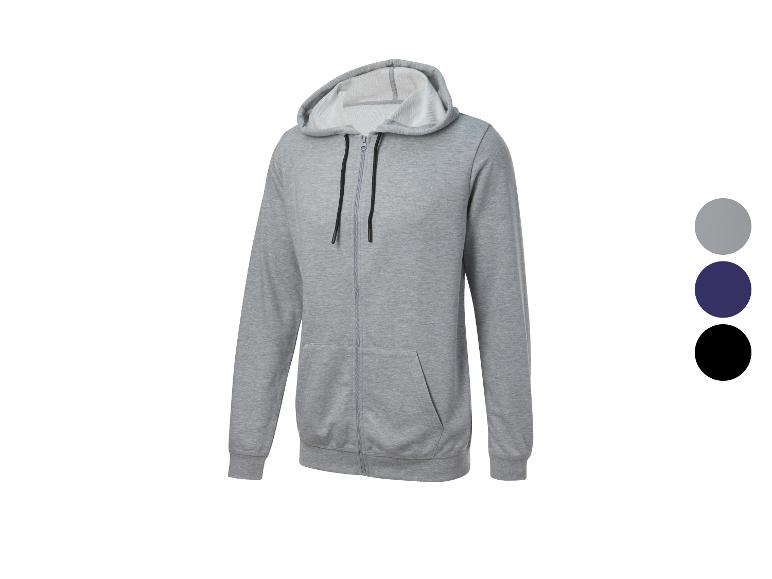 Un sweat-shirt gris à capuche et fermeture éclair