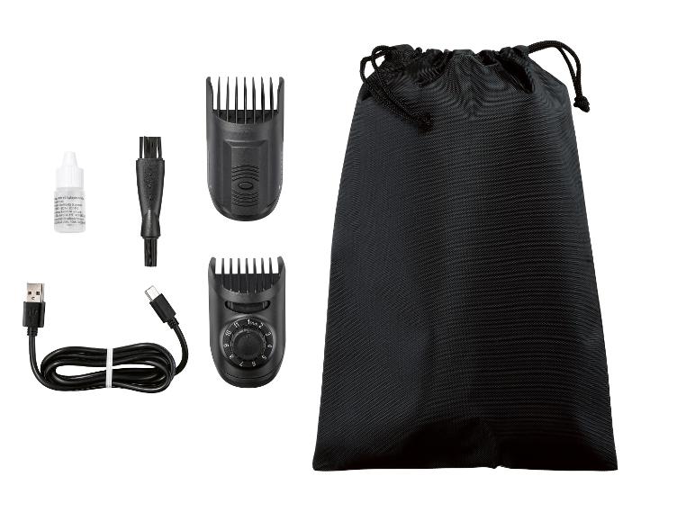 Tondeuse à cheveux avec réglage de longueur, étui, chargeur USB, huile et brosse.