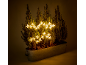 Jardinière décorative avec conifères et décorations lumineuses en forme d'étoiles.