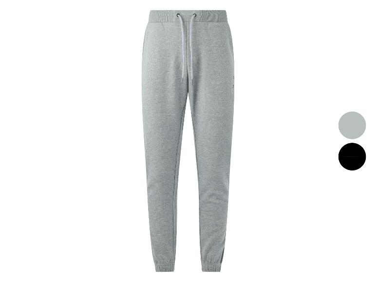 Pantalon de jogging gris avec cordon de serrage, disponible en gris et noir.