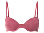 Un soutien-gorge rose avec des bonnets lisses et des bretelles fines.
