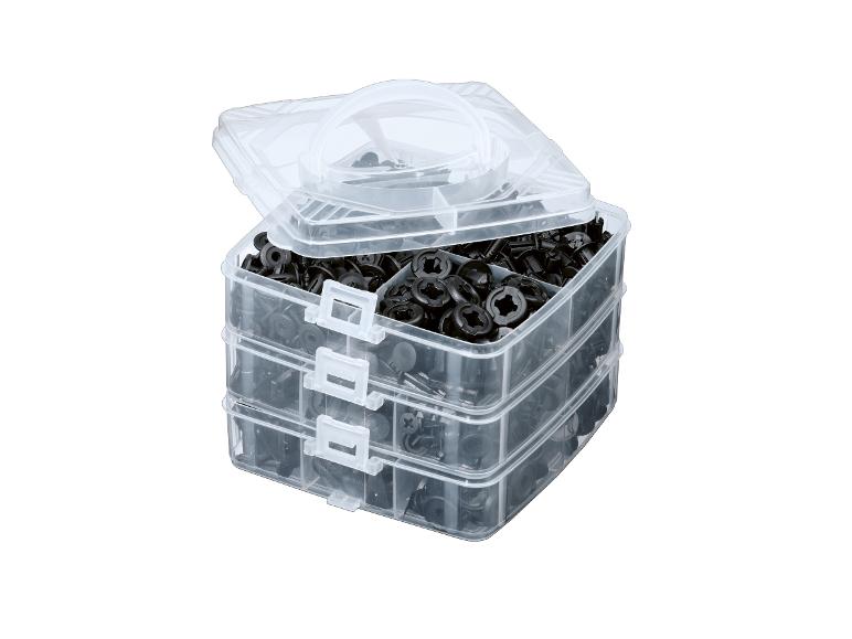 Boîte de fixation : vis et attaches noires en plastique.
