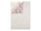 Parure de lit beige avec un motif floral au verso.