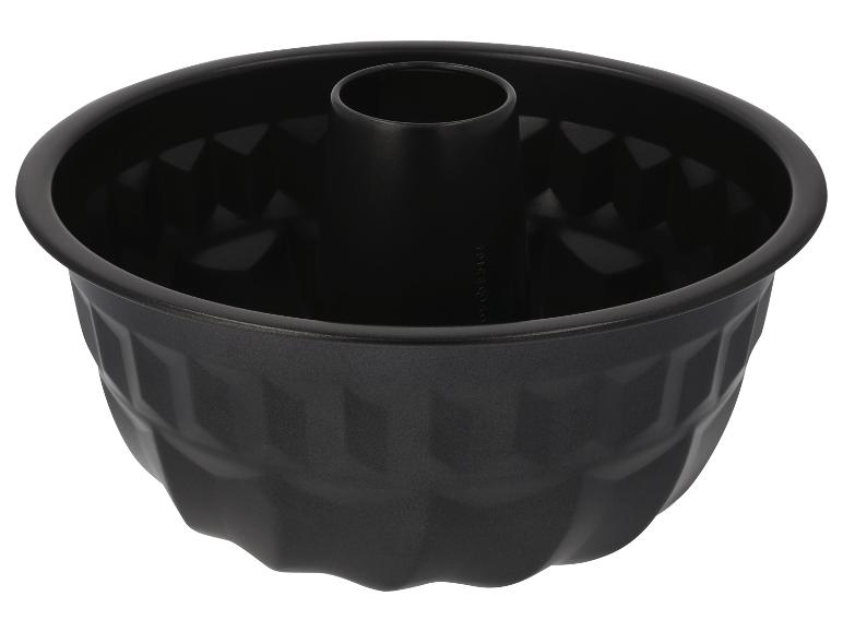 Moule à gâteau noir avec design cannelé et tube central.