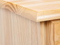 Le dessus d'une armoire en bois avec un tiroir.