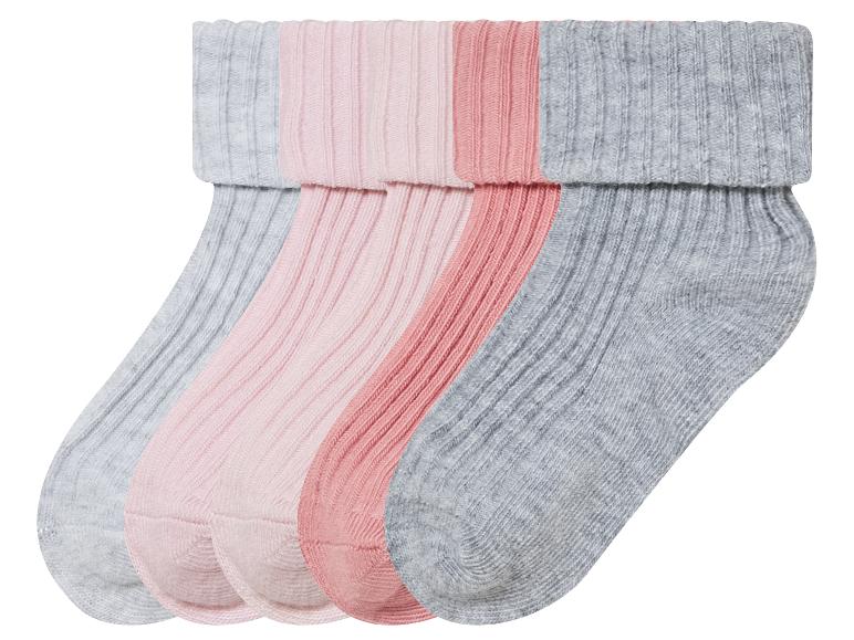 Trois paires de chaussettes en gris, rose et rose clair.