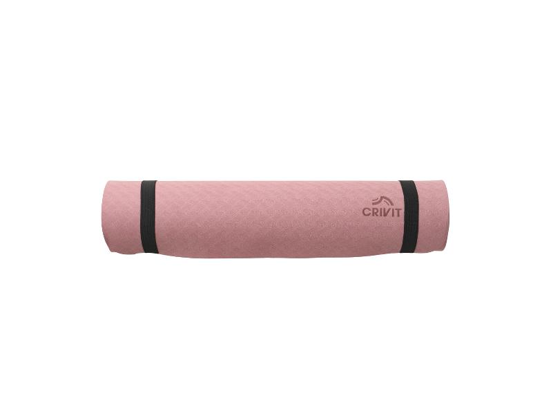 Tapis de yoga Crivit rose roulé avec sangles noires
