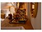 Lanterne LED LIVARNO home avec motif de feuilles sur une table en bois.
