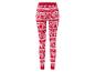 Leggings rouges avec un motif de Noël, des bonhommes en pain d'épices, des cannes en sucre et des flocons de neige.