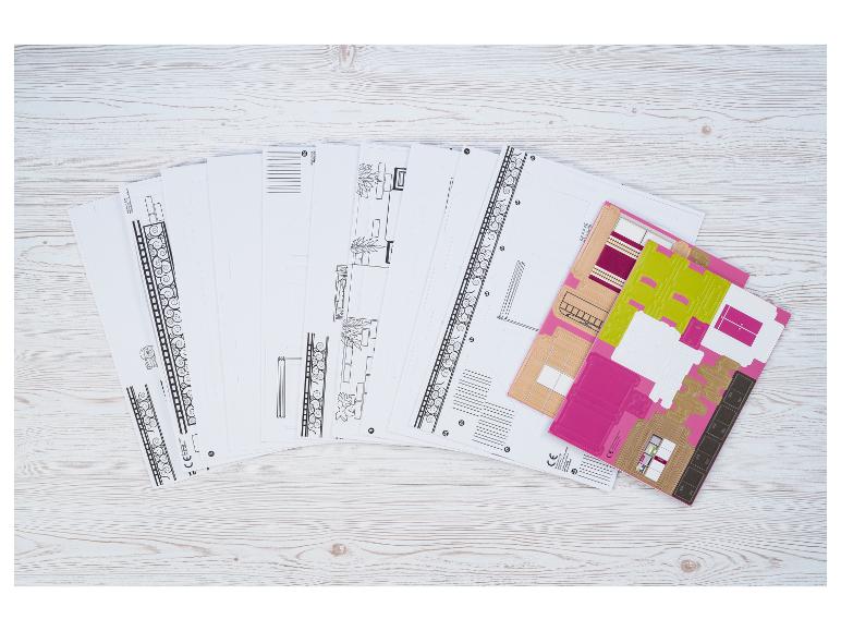Kit de loisirs créatifs en papier avec feuilles imprimées pour construire une maison ou une pièce miniature.