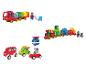 Un train de jouet avec des chiffres, un camion de fruits et légumes et divers véhicules.