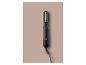 Brosse soufflante rotative noire avec des accents dorés et un cordon, sur fond beige.