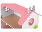 Une maison de poupée en bois avec un toit rose.