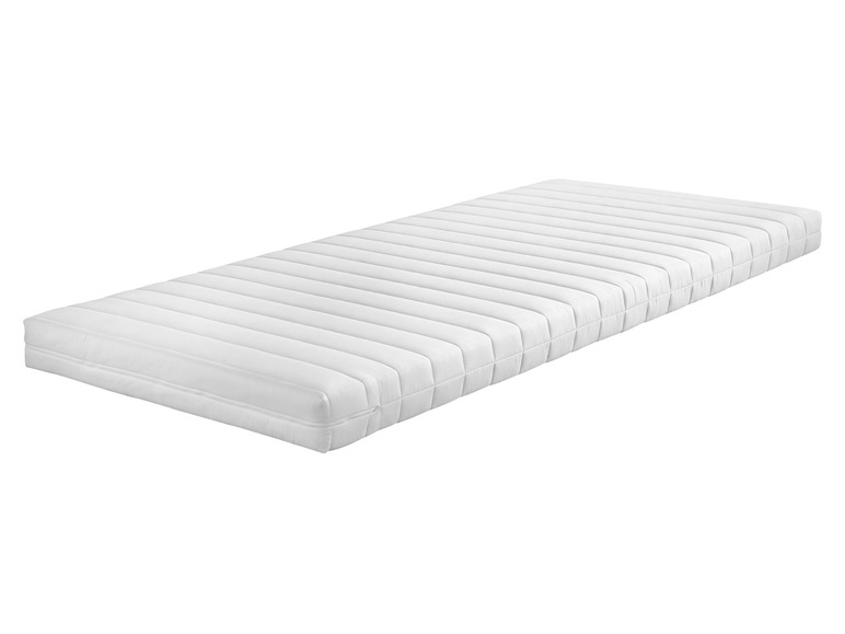 Un matelas blanc avec un revêtement matelassé