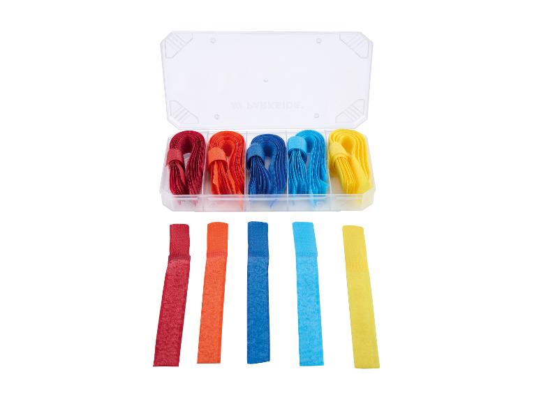 Assortiment de sangles scratch multicolores dans un boîtier : rouge, orange, bleu et jaune.