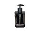Un distributeur de savon élégant noir avec un réservoir transparent.