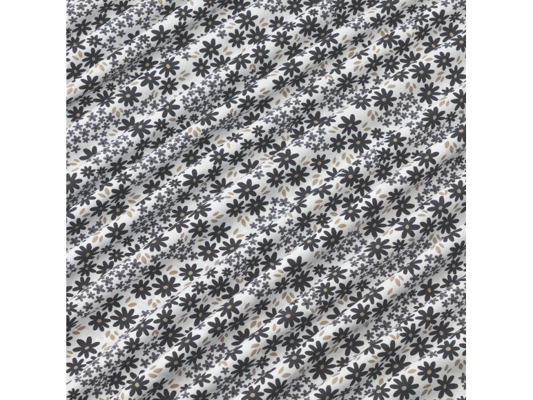 Tissu blanc avec un motif floral noir.