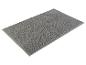 Tapis de bain gris texturé.