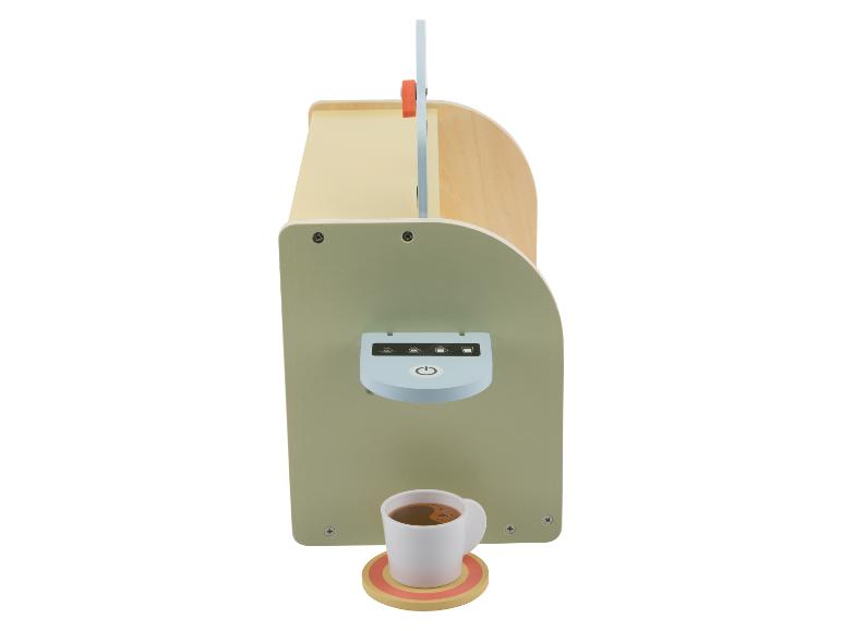 Machine à café jouet en bois pour enfants avec une tasse de café sur un sous-verre.