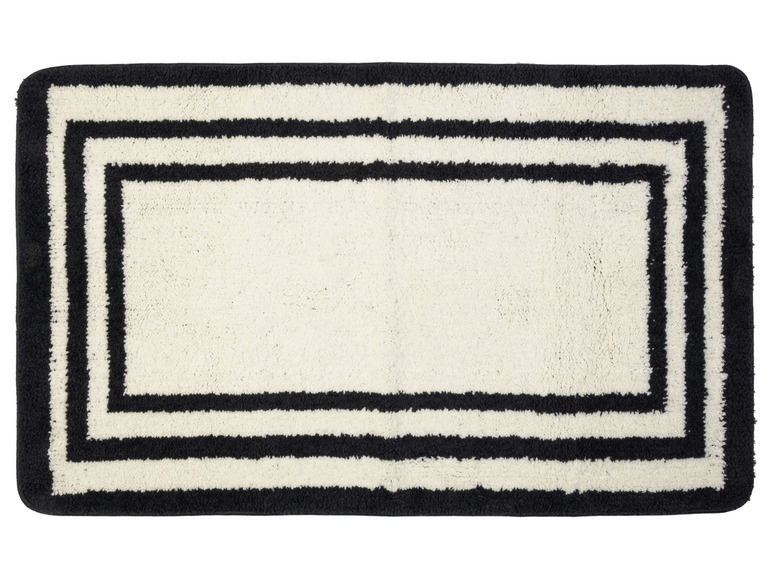 Un tapis de bain blanc avec des bordures noires.