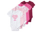 Un ensemble de bodys bébé en blanc, rose et rouge à rayures