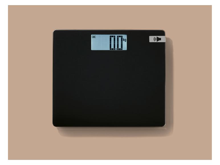 Pèse-personne noir avec affichage numérique indiquant «0.0 kg».