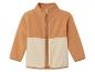 Une veste en polaire beige avec fermeture éclair.