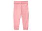 Pantalon bébé rose avec large ceinture repliable et bords-côtes.