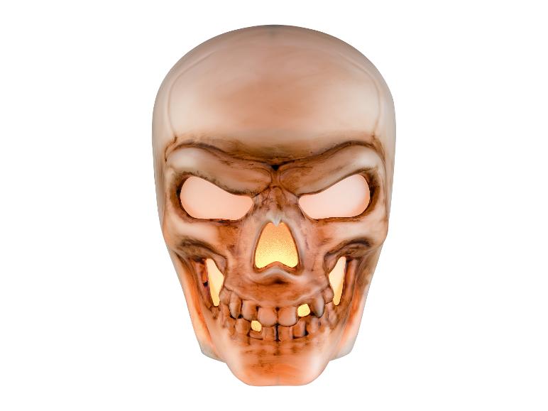 Décoration de crâne d'Halloween lumineuse avec yeux et nez brillants.
