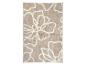 Tapis beige à motifs floraux.