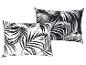 Deux coussins avec des feuilles de palmier noires et blanches.