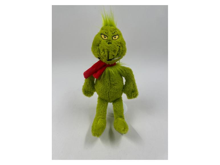 Peluche verte du Grinch avec une écharpe rouge et un microphone