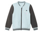 Une veste bomber bleu clair avec des manches noires et des étoiles blanches.