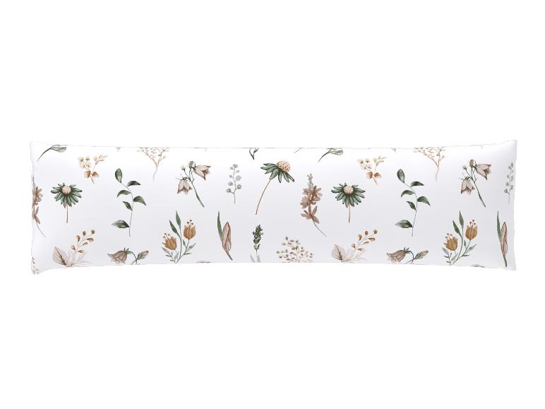 Oreiller blanc avec motif floral marron et vert.