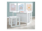 Une table et une chaise blanches pour enfants avec un motif arc-en-ciel, nuage et soleil.
