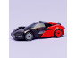 Voiture de sport jouet noire et rouge avec pare-brise transparent.