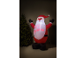 Père Noël gonflable lumineux avec l'inscription 'HO HO! CHRISTMAS' et un sapin de Noël.