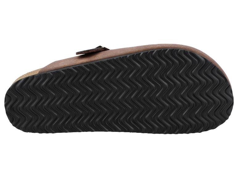 Dessous d'une sandale marron avec une semelle noire ondulée.