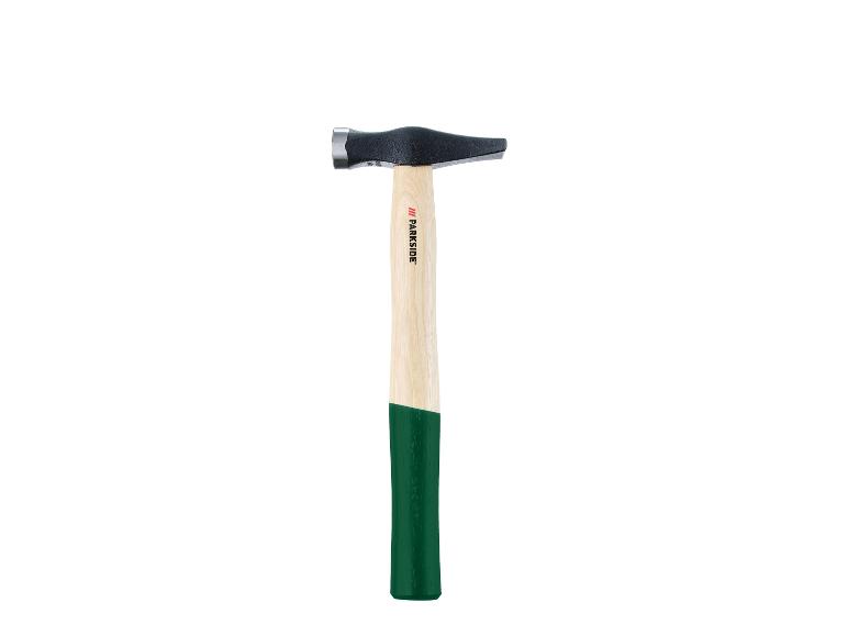 Marteau de maçon PARKSIDE avec manche en bois et poignée verte.