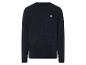 Un pull bleu marine avec un motif en câble et un petit logo.