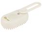Brosse à cheveux crème pour bébé avec des picots doux et une poignée pliable.