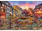 Puzzle représentant une ruelle européenne pittoresque au bord d'un canal au coucher du soleil.