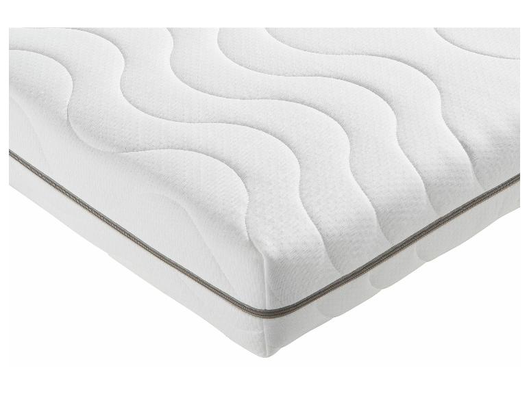 Un matelas blanc avec une fermeture éclair grise.