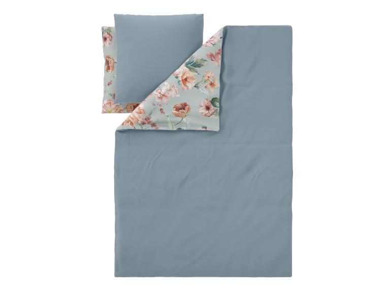 Parure de lit et taie d'oreiller à motif floral bleu-gris.