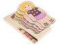 Puzzle en bois avec une fille, son squelette, ses muscles et ses organes.